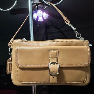 Vintage Coach Tan Leather wristlet .